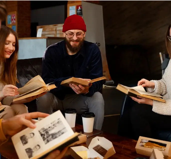 side view people holding books